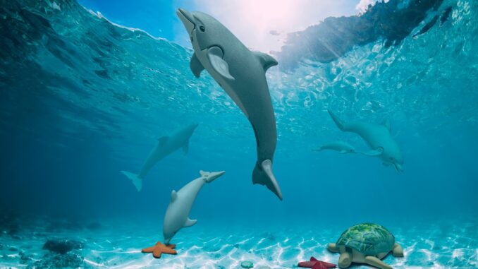 Blue ocean with white sand bottom underwater in Hawaii